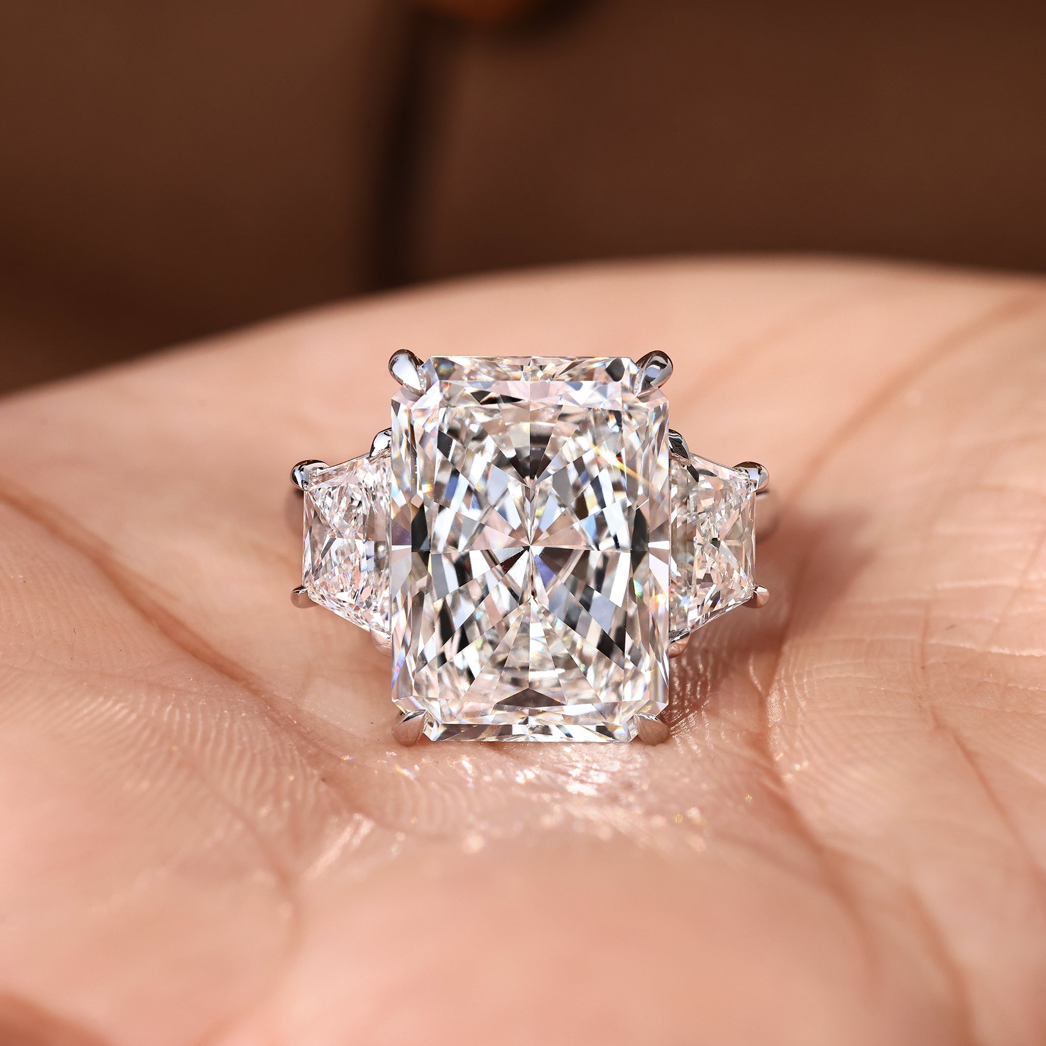 10 - 14 Carat Radiant Cut Diamond Ring with Trapezoid Side Stones