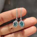 Oval Cut Earrings In Halo Style