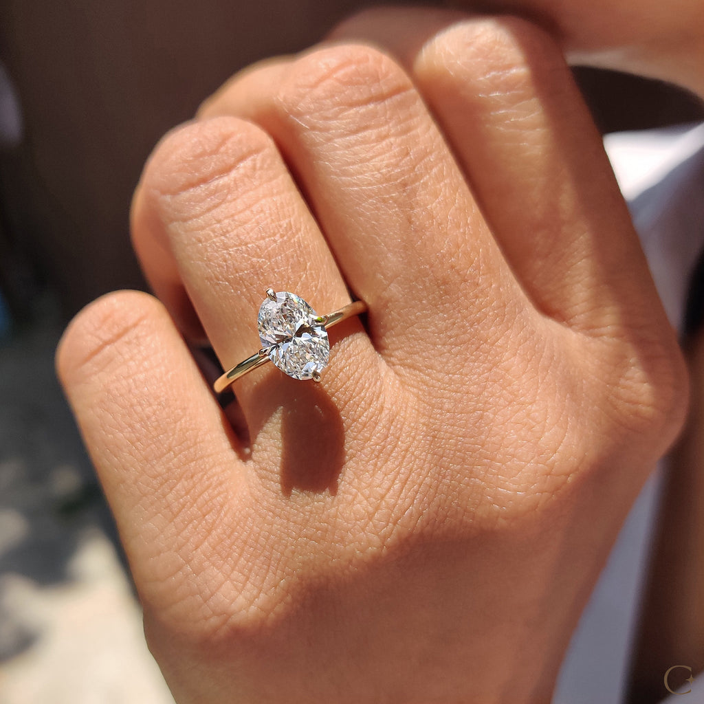 Oval Solitaire Diamond Ring With Compass Prong
