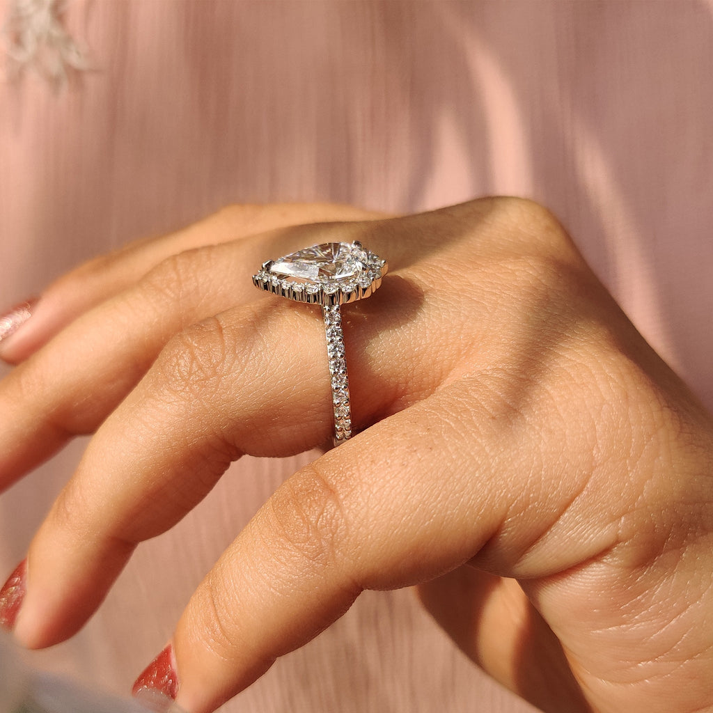 Pear Shaped Halo Engagement Ring In Round Cut Halo Style