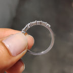 Shared Prong Eternity Band With Round And Baguette Moissanite