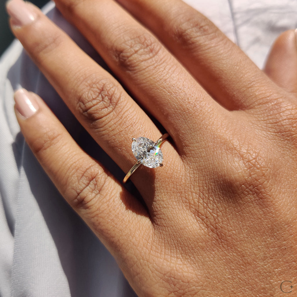 Oval Solitaire Diamond Ring With Compass Prong