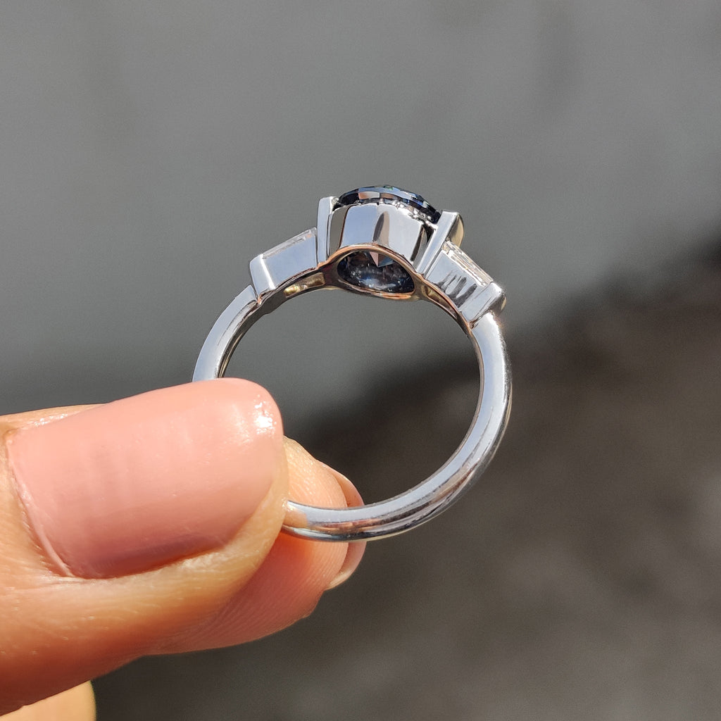 Round And Tapered Baguette Three Stone Engagement Ring