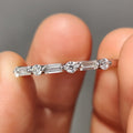 Shared Prong Eternity Band With Round And Baguette Moissanite