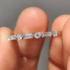 Shared Prong Eternity Band With Round And Baguette Moissanite