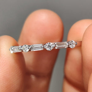 Shared Prong Eternity Band With Round And Baguette Moissanite