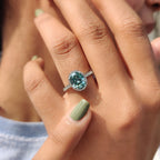 Oval Halo Engagement Ring With Cyan Blue Stone