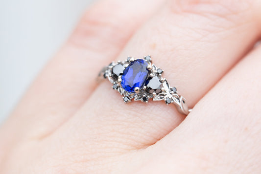 rose three stone with blue sapphire and black diamonds engagement rings