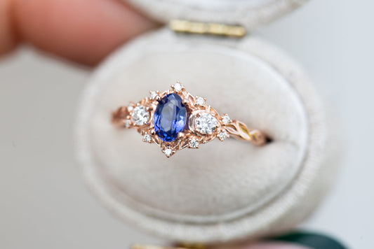 oval cut crescent moon with oval blue sapphire engagement rings