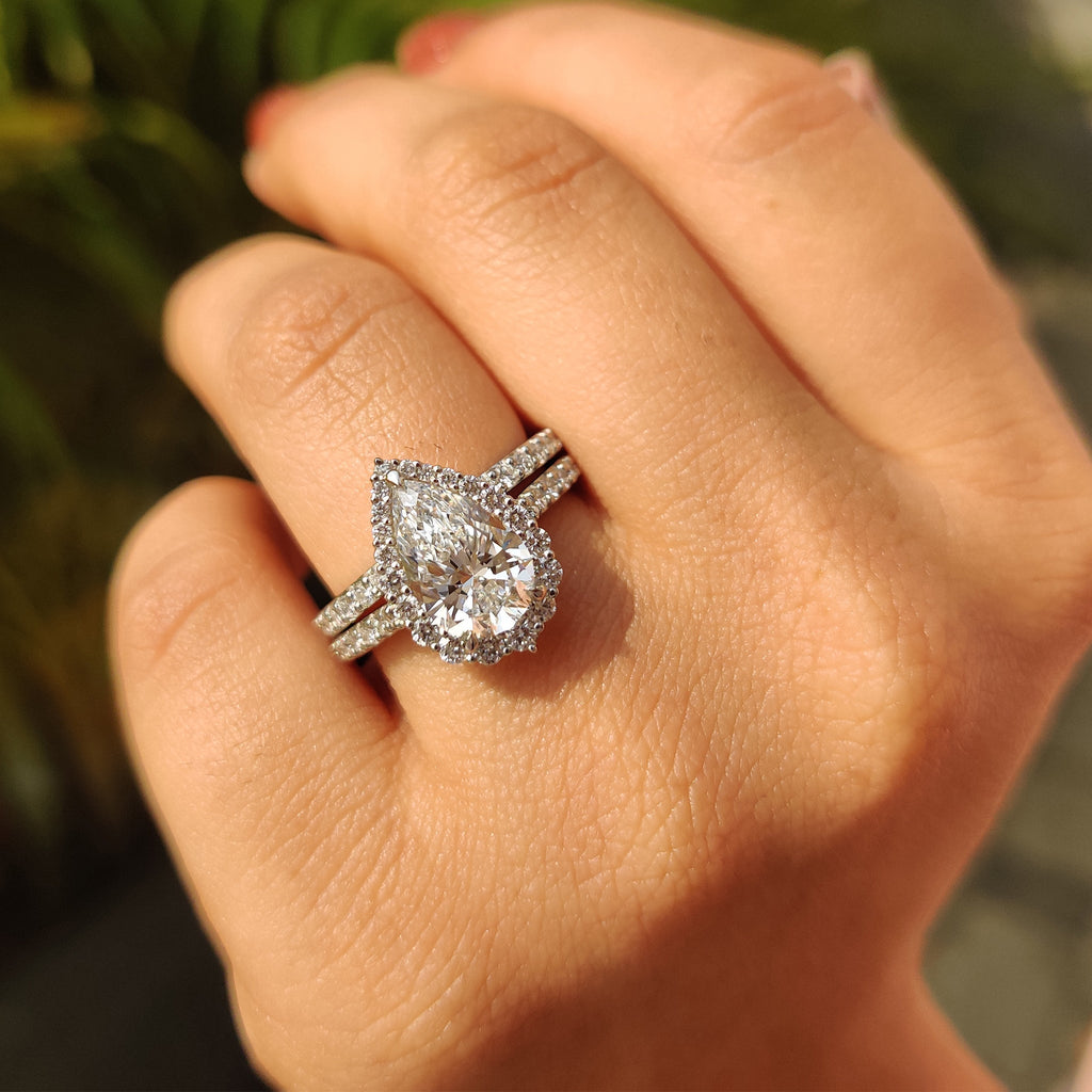 Pear Shaped Halo Engagement Ring In Round Cut Halo Style