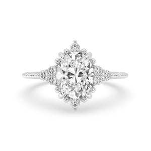 Oval Diamond Ring With Round Side Stone