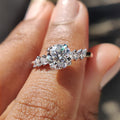 side stone engagement ring with round and marquise cut