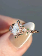 2 caret pear center lab grown with Briar moon three stone rings DisneyValley