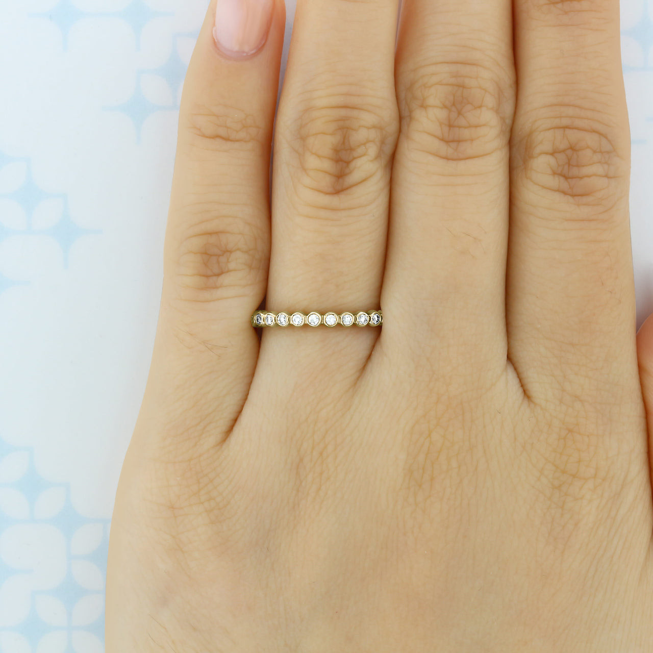 0.38 TCW Round Cut Bezel Style Moissanite Wedding Band