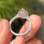 Pear Shaped Halo Engagement Ring In Round Cut Halo Style