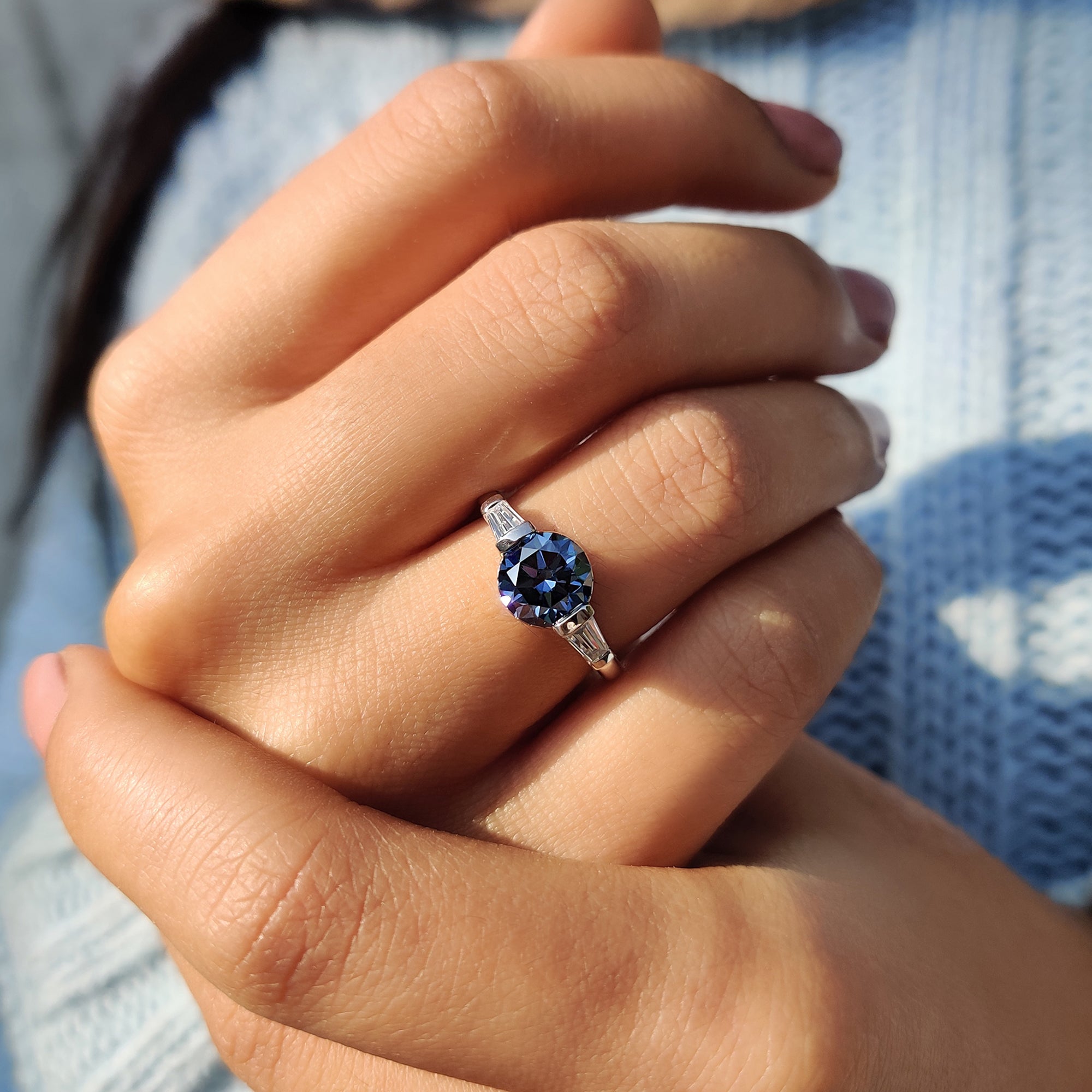 Round And Tapered Baguette Three Stone Engagement Ring