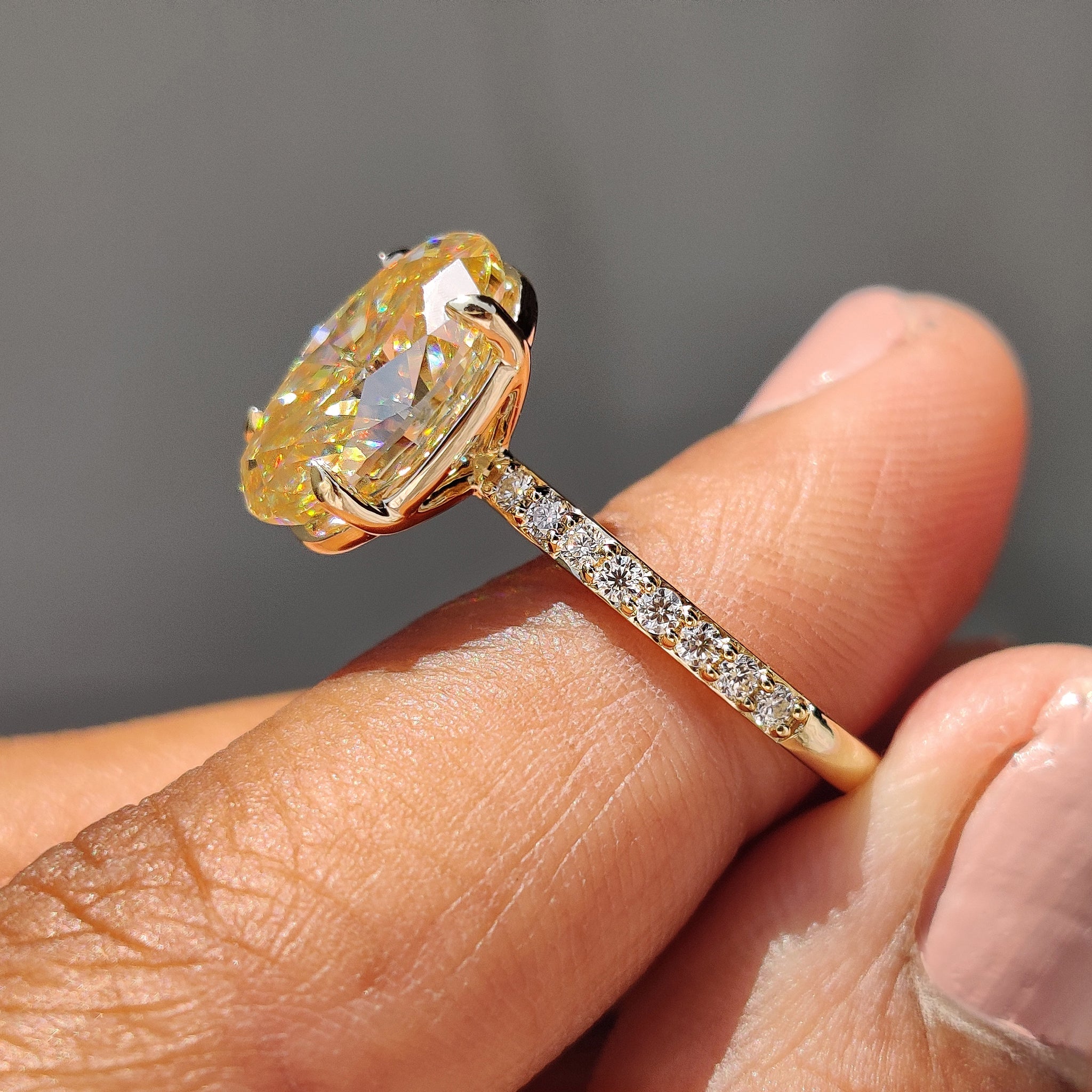 Yellow Oval Moissanite engagement ring in pave set