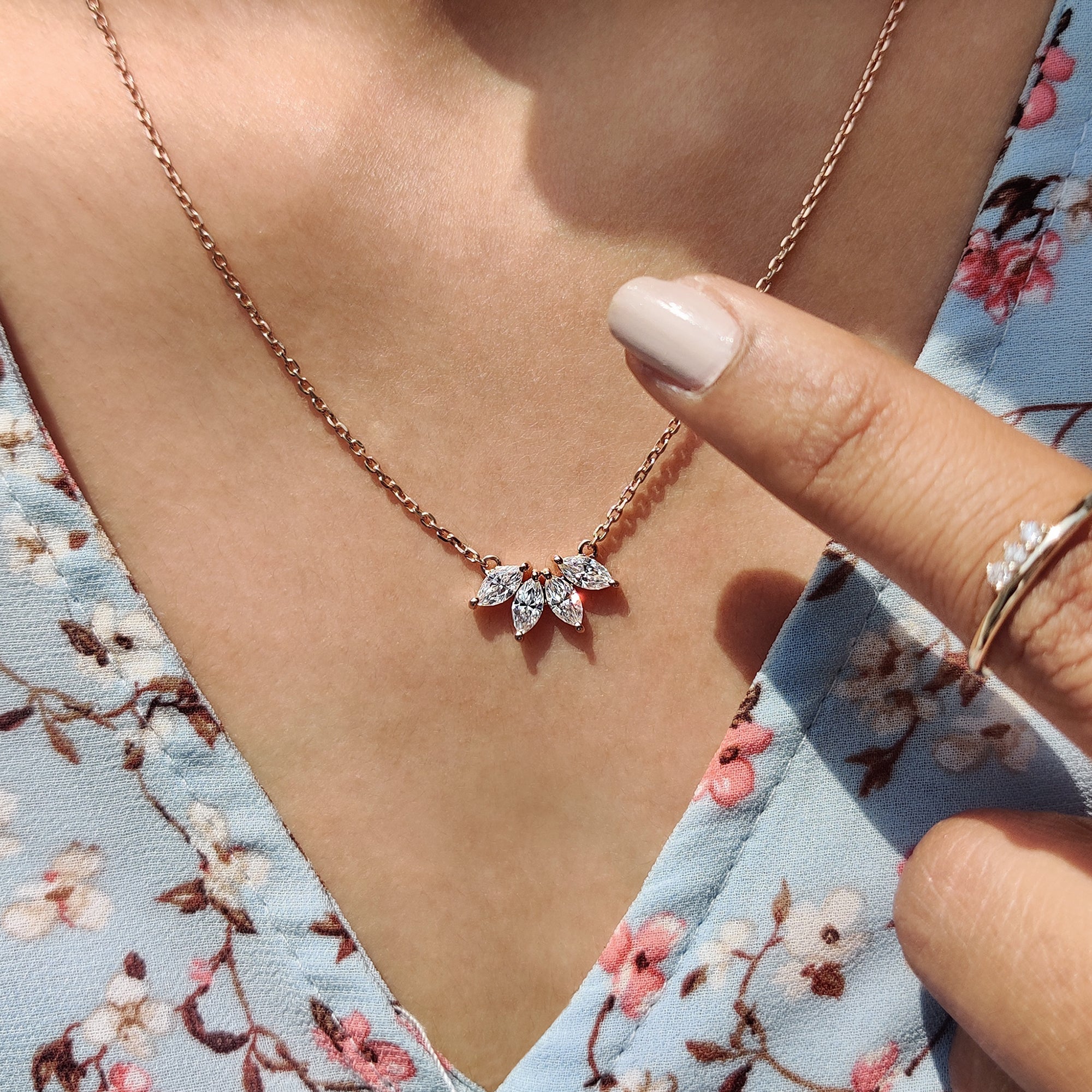 Arc Marquise Moissanite Pendant In Four Stone Design