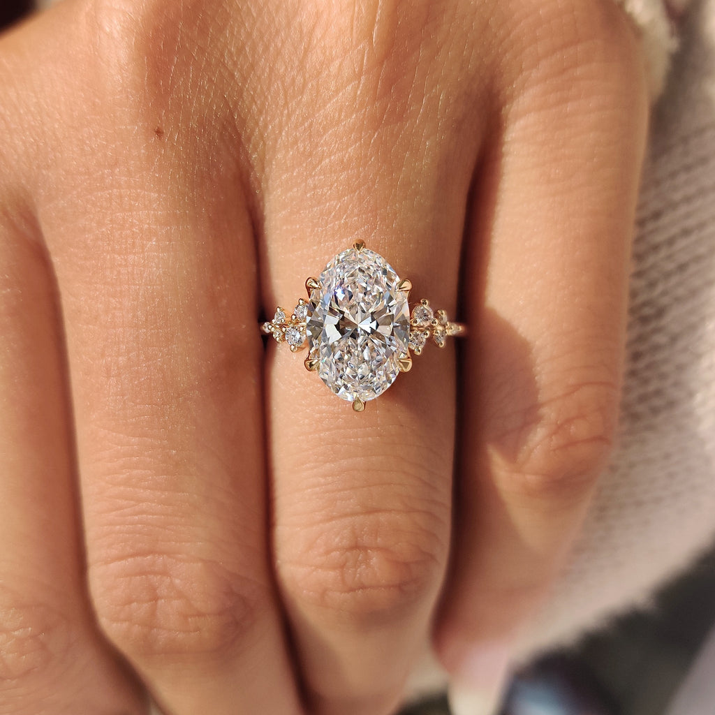Oval Diamond Ring With Round Side Stones