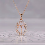 Rose Gold Aries Pendant In Halo Design