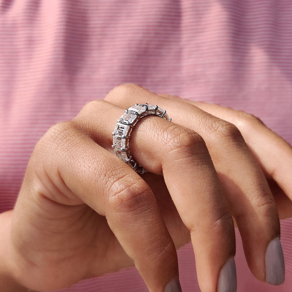 Emerald Wedding Band In A Shared Prong Design