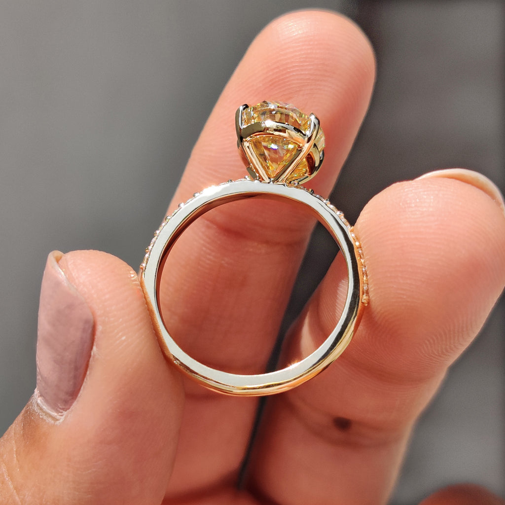 Yellow Oval Moissanite engagement ring in pave set