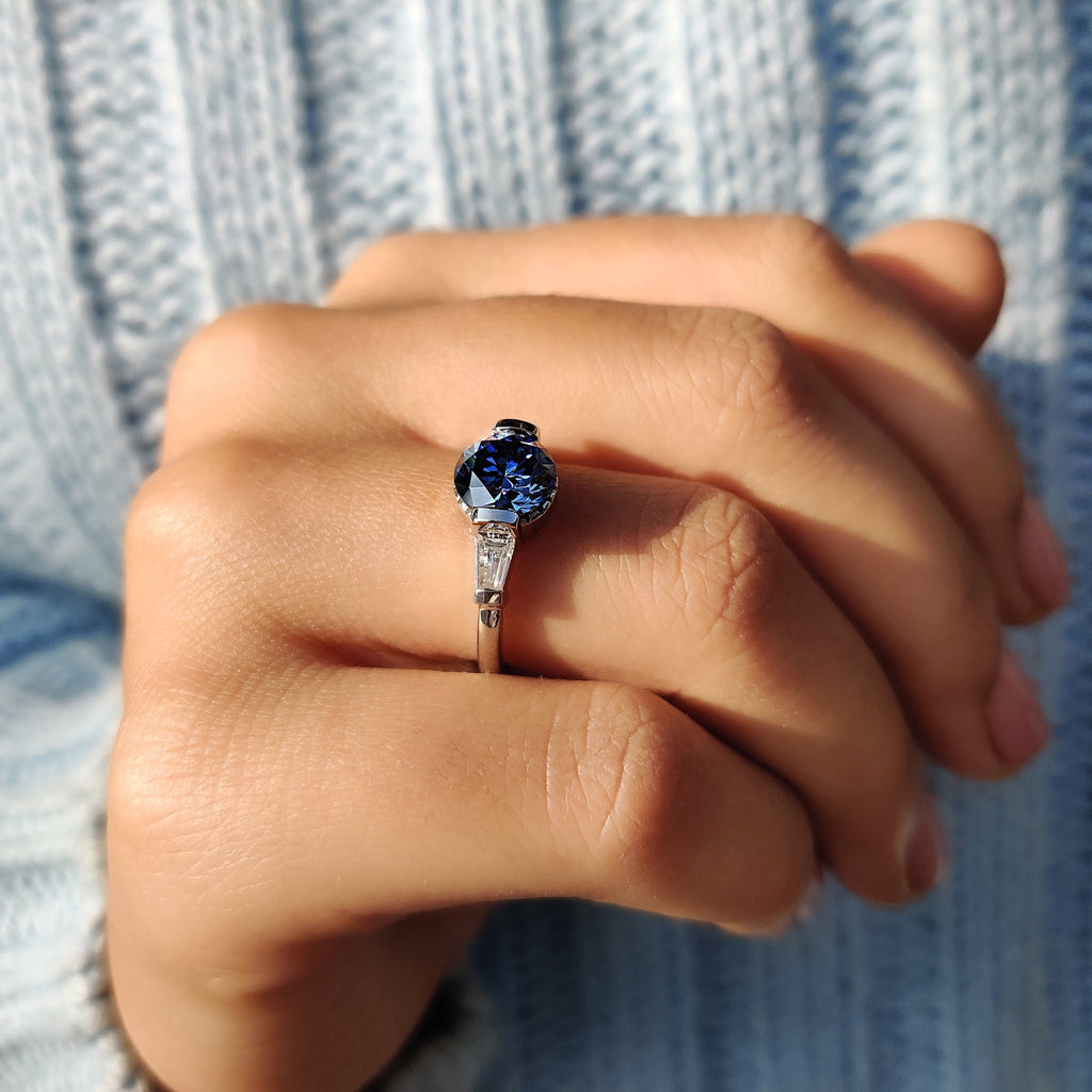 Round And Tapered Baguette Three Stone Engagement Ring