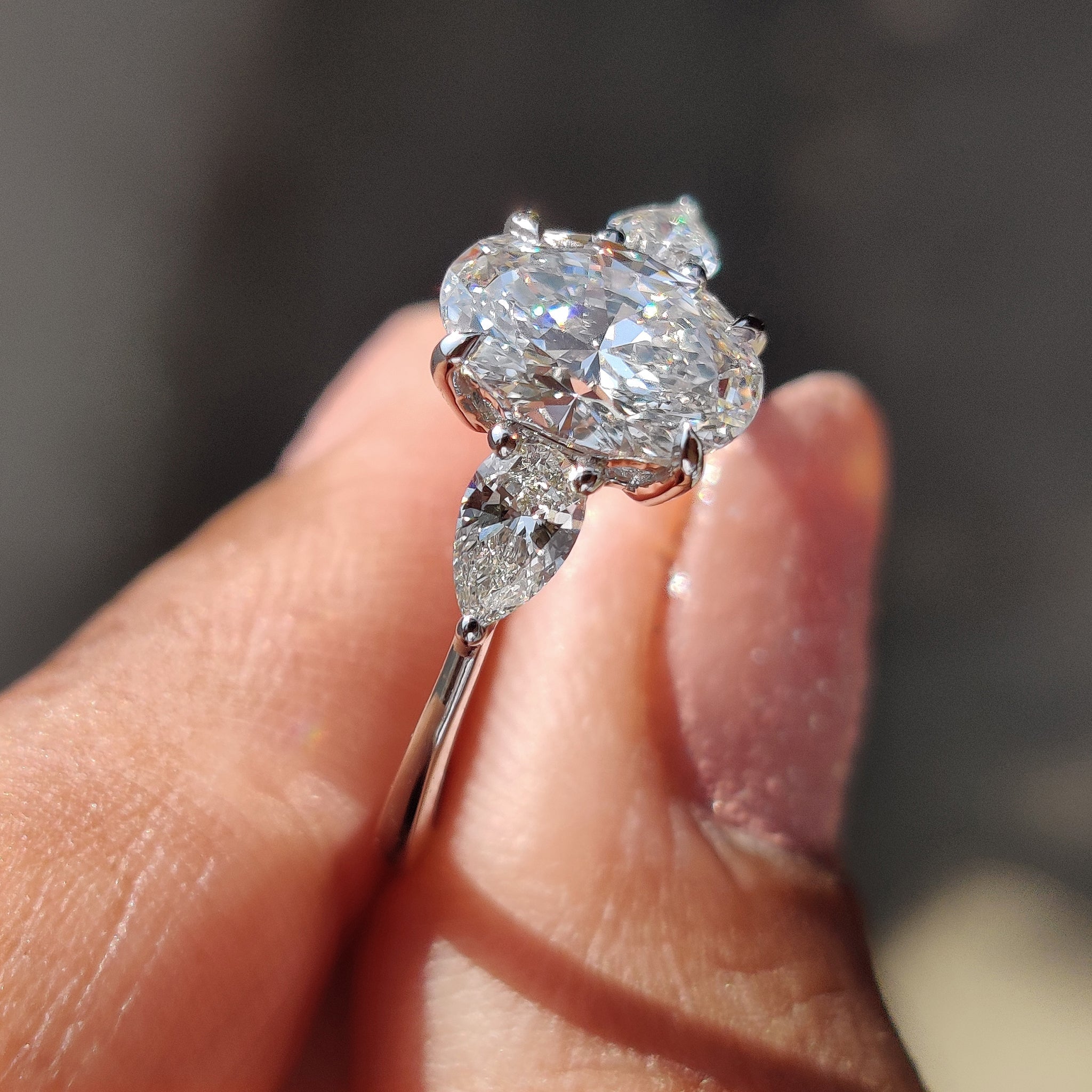 3 Stone Diamond Ring With Oval And Pear Cut