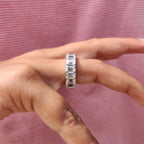 Emerald Wedding Band In A Shared Prong Design