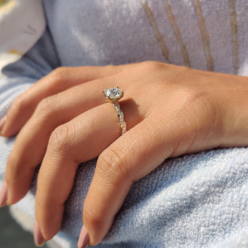 Round Cut Moissanite Engagement Ring Featuring Twisted Pave Set