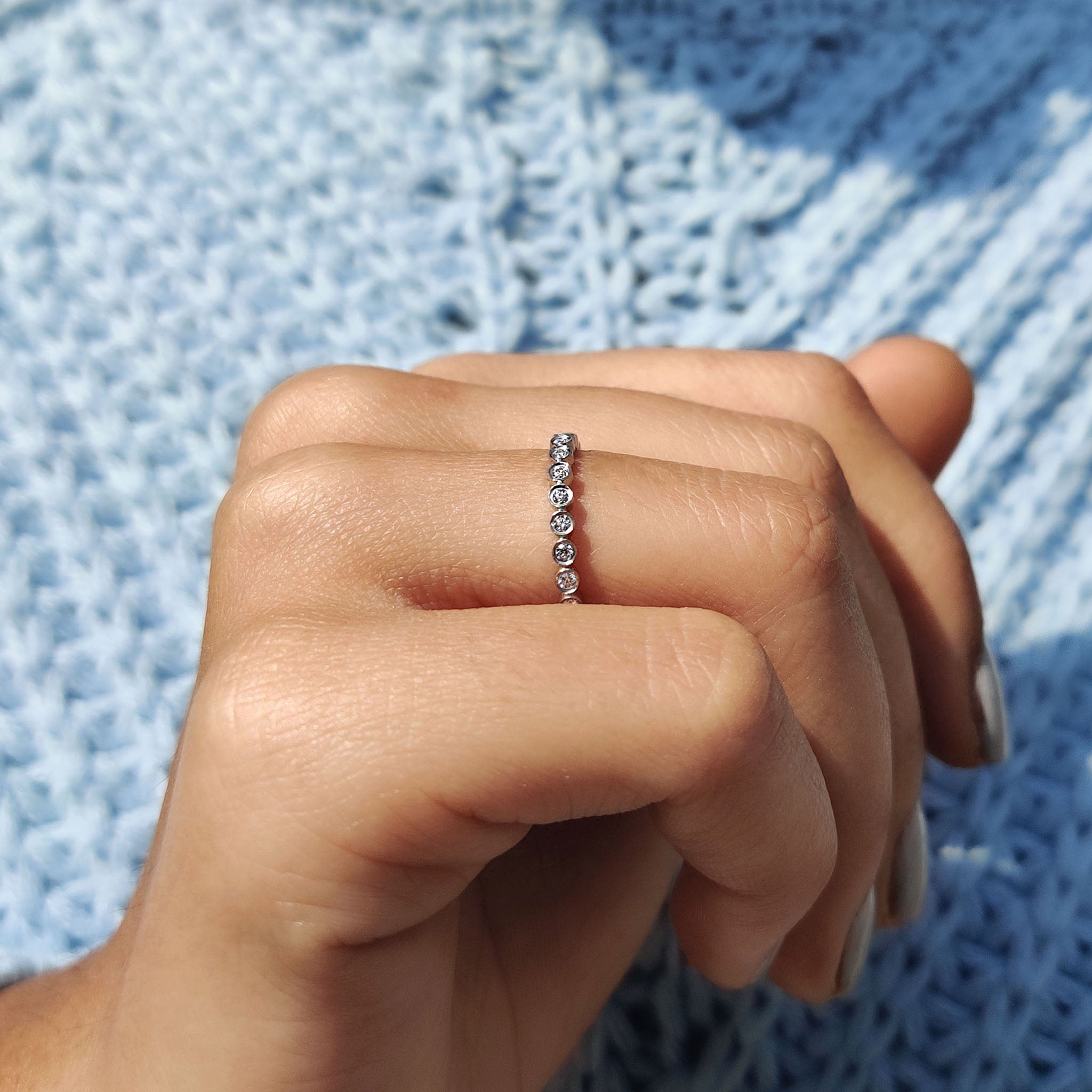 Round Eternity Band In a Smooth Bezel Set Design