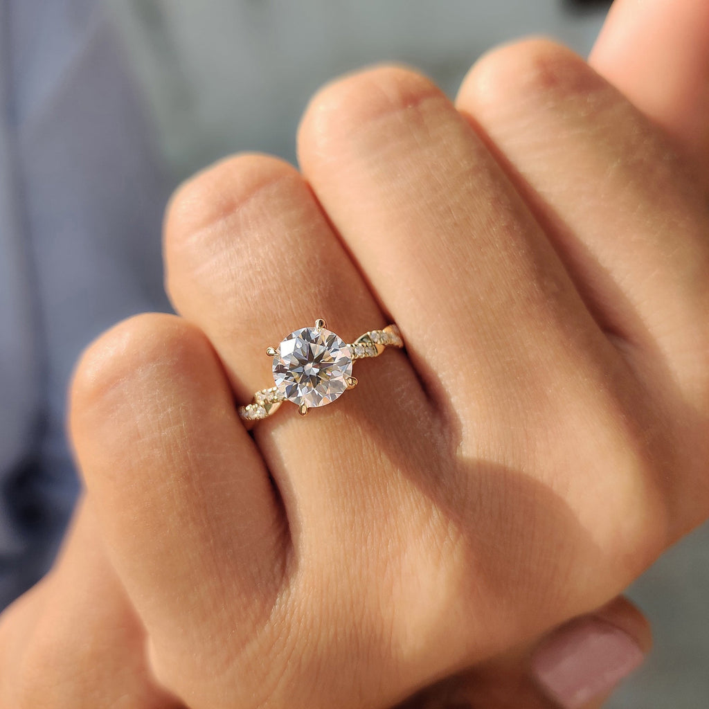 Round Cut Moissanite Engagement Ring Featuring Twisted Pave Set
