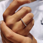 Shared Prong Eternity Band With Round And Baguette Moissanite