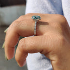 Oval Halo Engagement Ring With Cyan Blue Stone