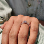 side stone engagement ring with round and marquise cut