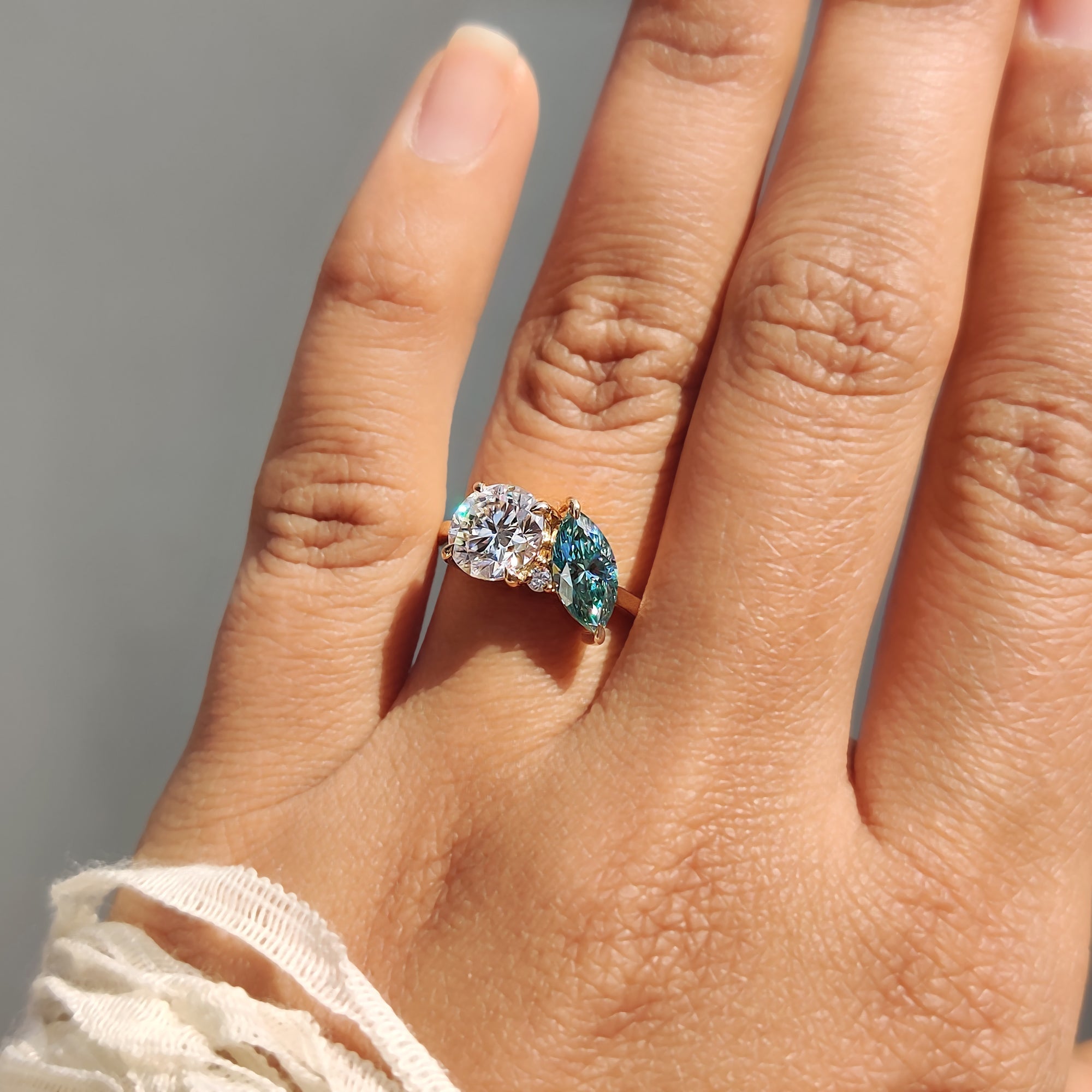 Three Stone Moissanite Ring In Marquise And Round Cut