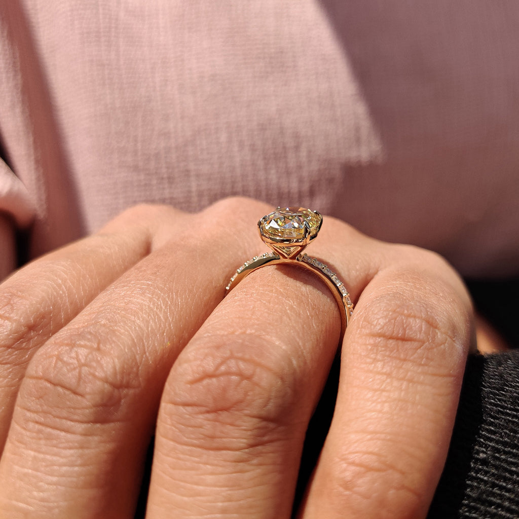 Yellow Oval Moissanite engagement ring in pave set