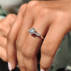 side stone engagement ring with round and marquise cut