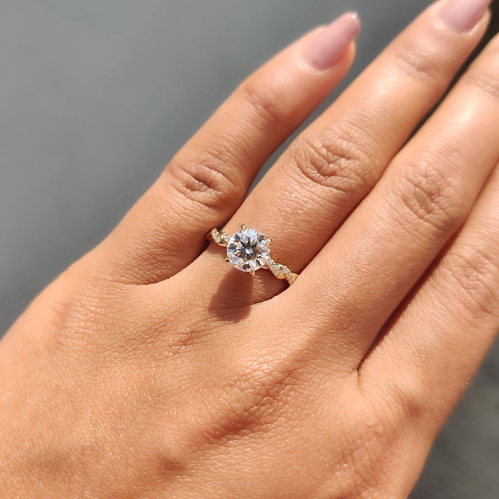 Round Cut Moissanite Engagement Ring Featuring Twisted Pave Set