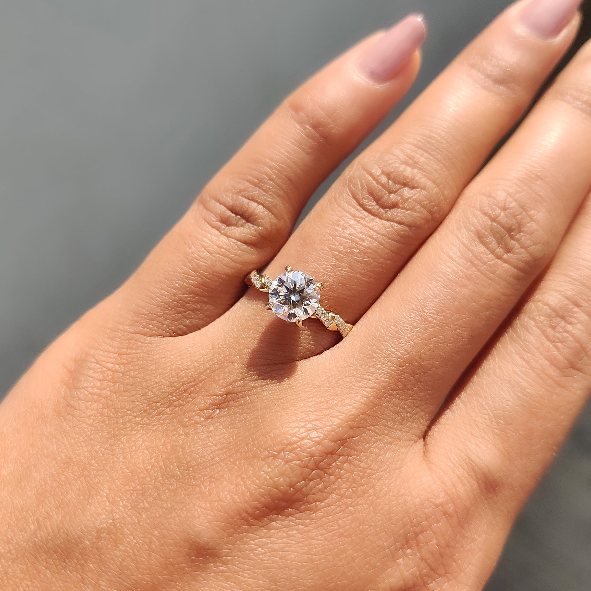 Round Cut Moissanite Engagement Ring Featuring Twisted Pave Set
