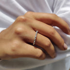 Shared Prong Eternity Band With Round And Baguette Moissanite
