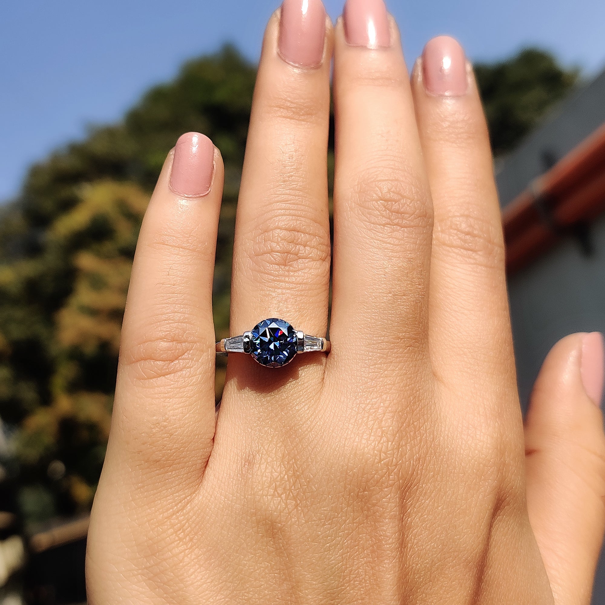 Round And Tapered Baguette Three Stone Engagement Ring