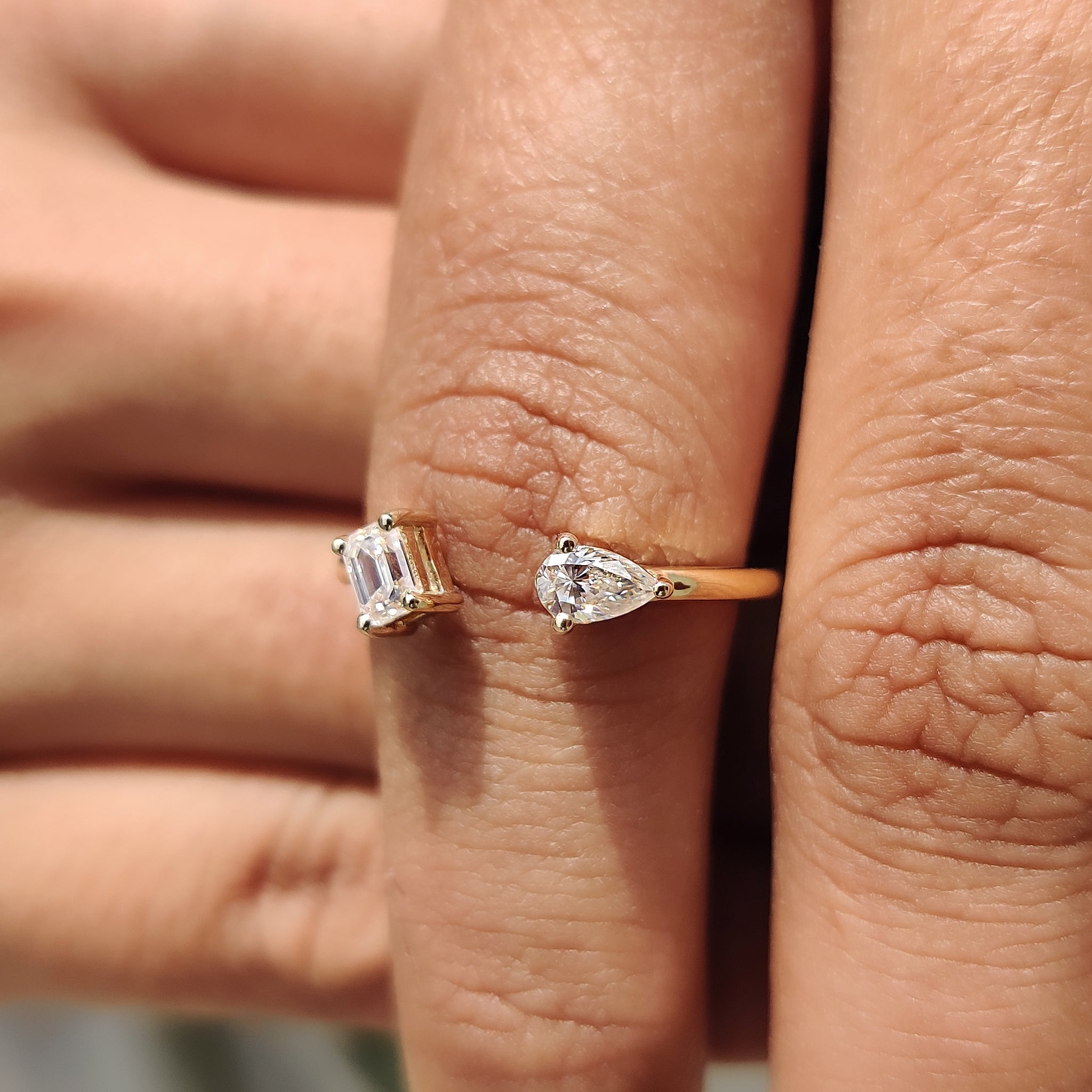 2 Stone Engagement Ring Featuring Emerald and Pear Cut