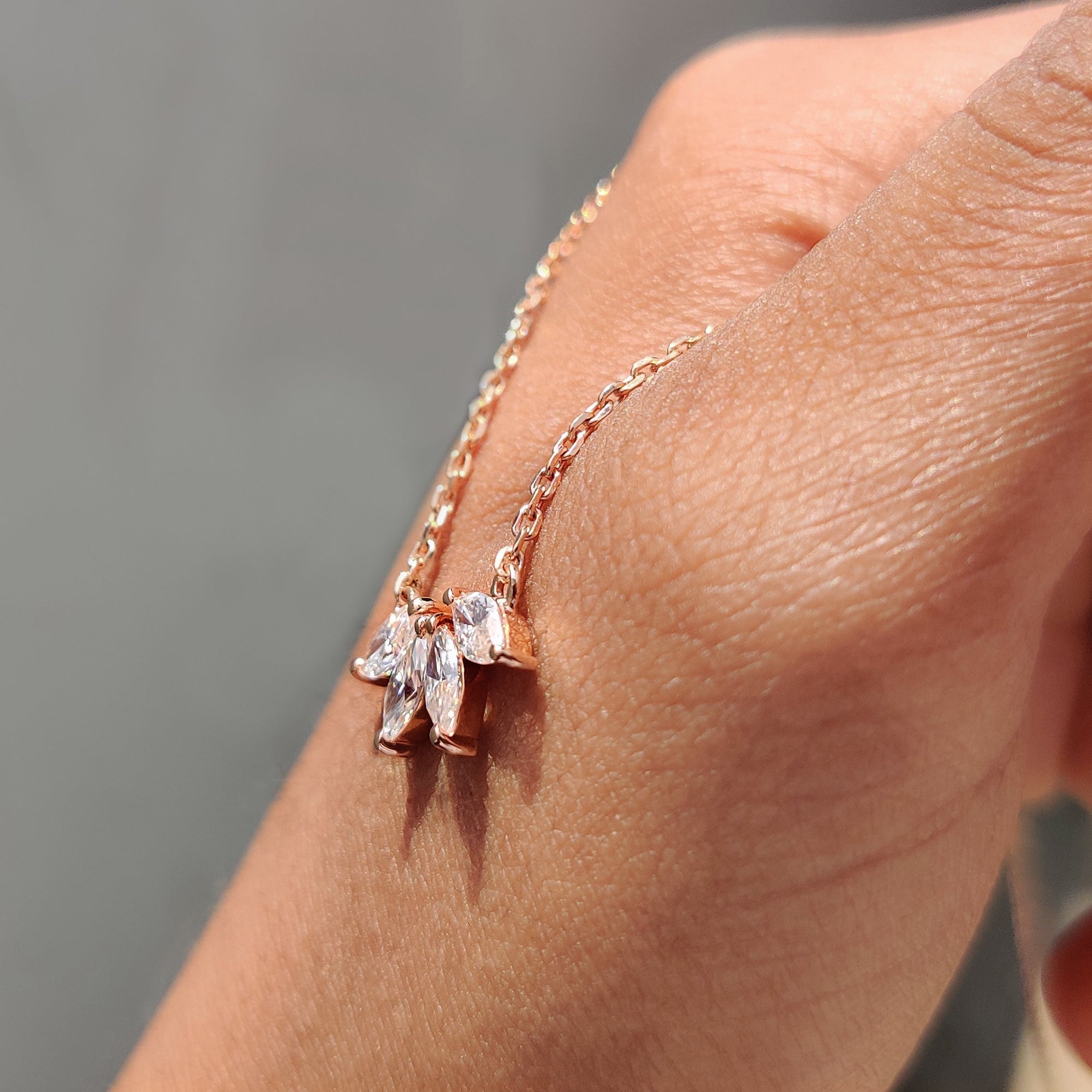 Arc Marquise Moissanite Pendant In Four Stone Design