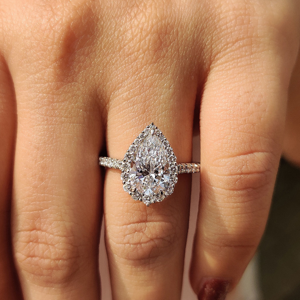 Pear Shaped Halo Engagement Ring In Round Cut Halo Style