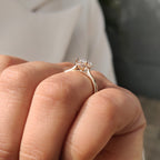 Oval Cut Art Deco Diamond Ring with Two Emerald Side Gemstones
