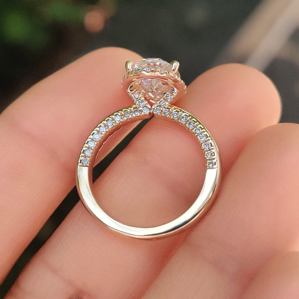 Oval Cut Diamond Ring in Round Cut Diamond Basket Setting