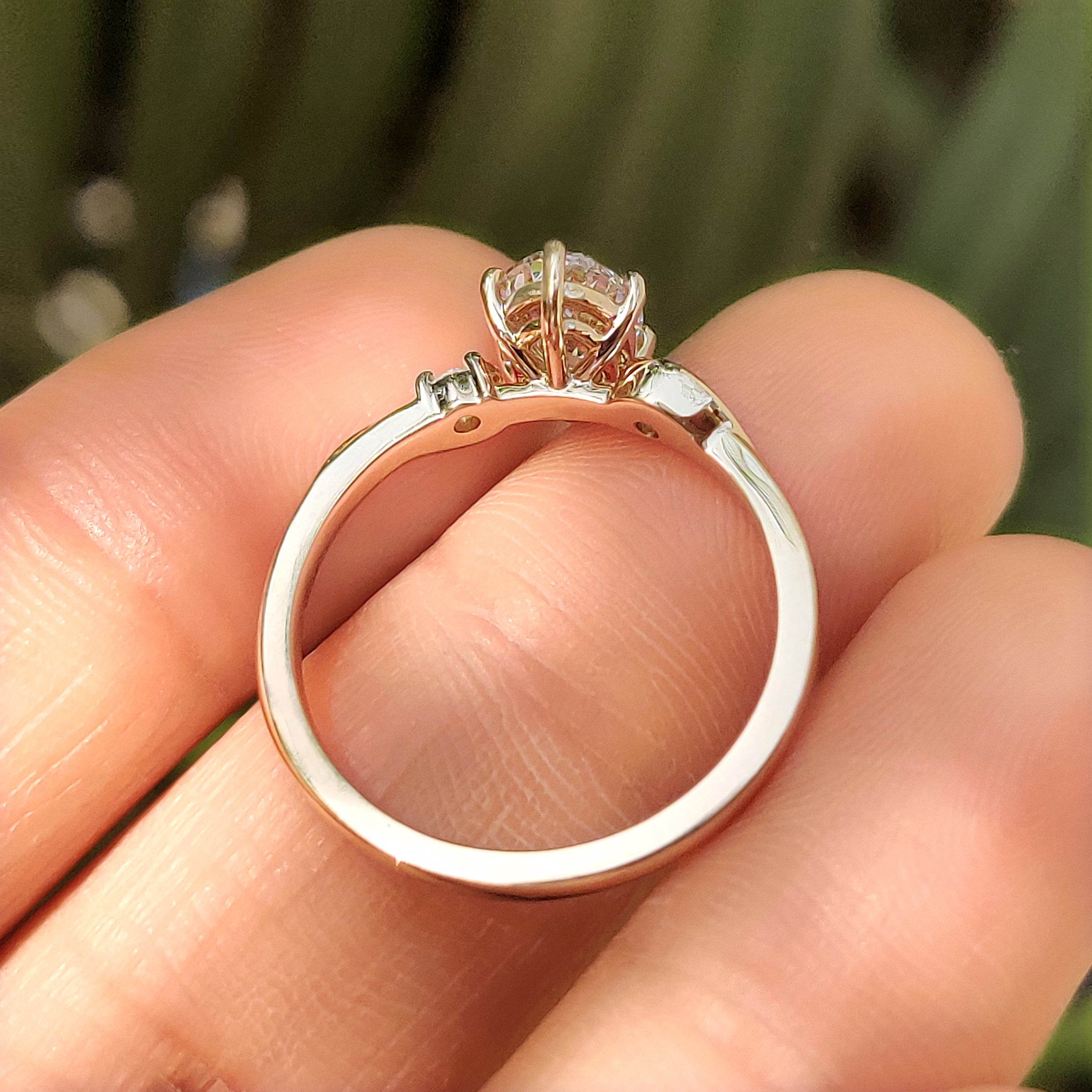 Three Stone Style Oval Cut Engagement Ring with Round Side Stone