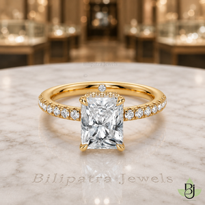 Jewelry Photography Specifications. Visual Style & Composition. Produce ultra-realistic macro photography of the uploaded Product, capturing every detail with precision. Set the Product on a table White Marble surface to achieve a refined and timeless luxury aesthetic. Utilize background bokeh mode to simulate professional jewelry showroom scenes. Maintain absolute fidelity to the reference file regarding product design, diamond details, and camera angles. Technical Requirements & Branding. Output image quality must be exactly 2000 x 2000 pixels. Metal Color Change to Yellow Gold.