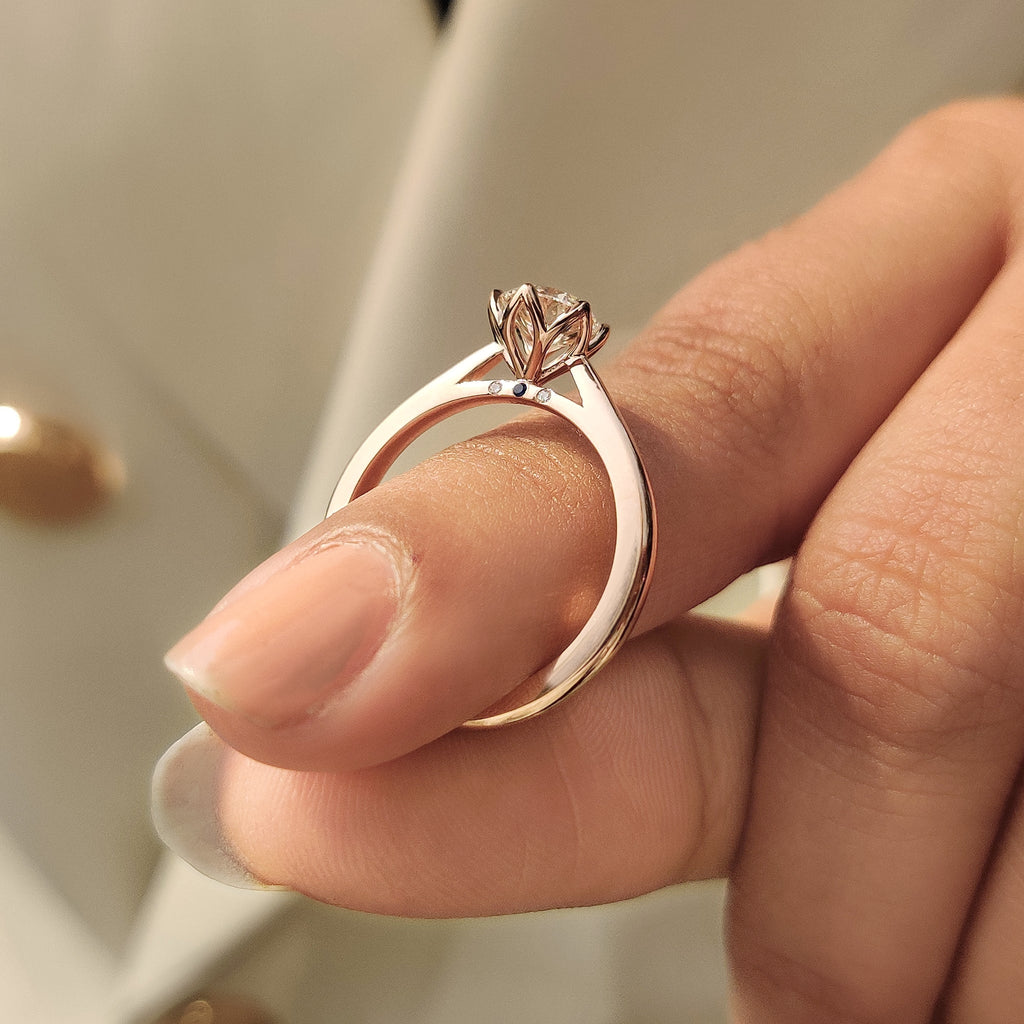 Solitaire Style Round Cut Diamond Ring with Hidden Blue Sapphire